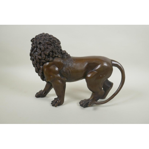 234 - A filled bronze lion, 31cm long