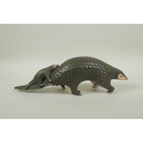 235 - A cold painted bronze pangolin and its young, 32cm long