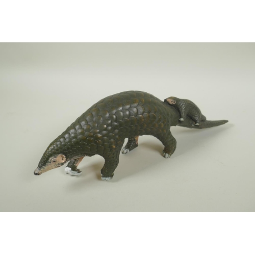 235 - A cold painted bronze pangolin and its young, 32cm long