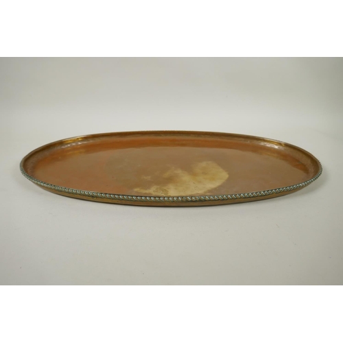 237 - A Hugh Wallis Arts & Crafts brass tray, circa 1900, bears maker's stamp to top, 52 x 28cm