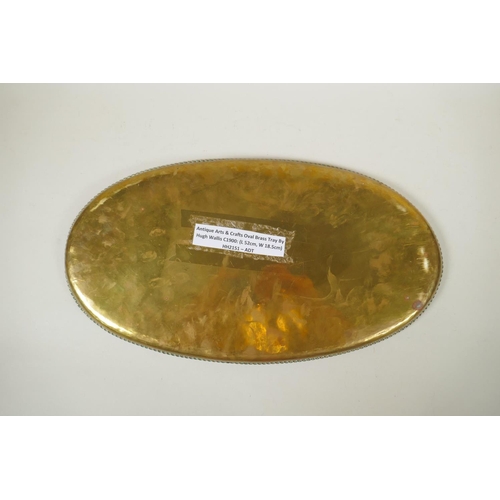 237 - A Hugh Wallis Arts & Crafts brass tray, circa 1900, bears maker's stamp to top, 52 x 28cm