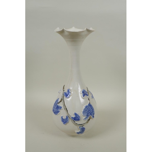 238 - A Japanese blue and white porcelain pear shaped vase with flared rim and vine decoration, 30cm high