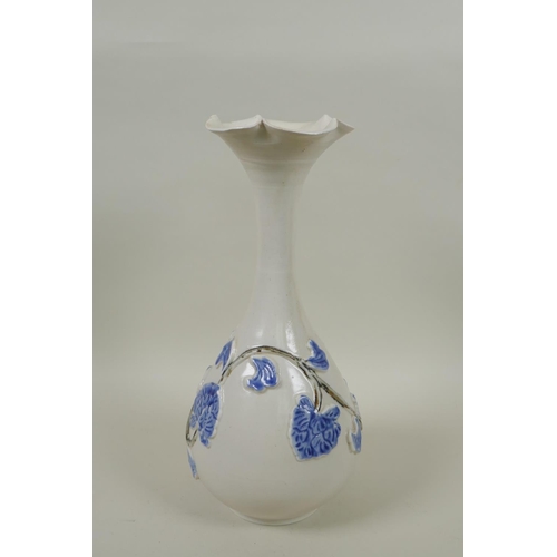 238 - A Japanese blue and white porcelain pear shaped vase with flared rim and vine decoration, 30cm high