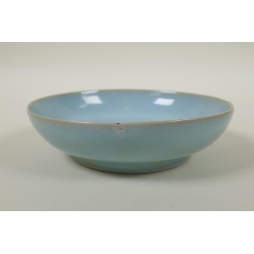 240 - A Chinese ru ware style shallow porcelain dish, 14cm diameter