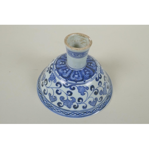 246 - A Chinese blue and white porcelain stem cup with scrolling decoration, Xuande 6 character mark to bo... 