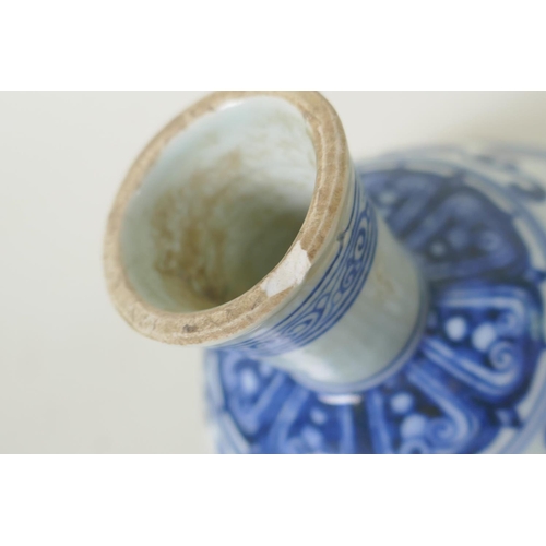 246 - A Chinese blue and white porcelain stem cup with scrolling decoration, Xuande 6 character mark to bo... 