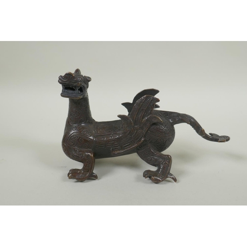 250 - A Chinese filled bronze dragon/kylin, 19cm long