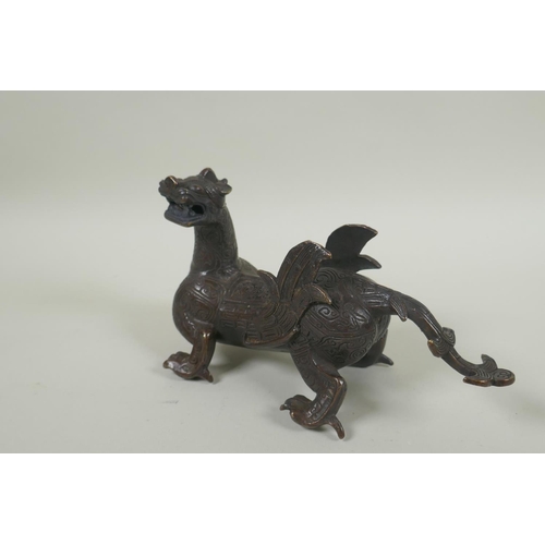 250 - A Chinese filled bronze dragon/kylin, 19cm long