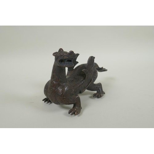 250 - A Chinese filled bronze dragon/kylin, 19cm long