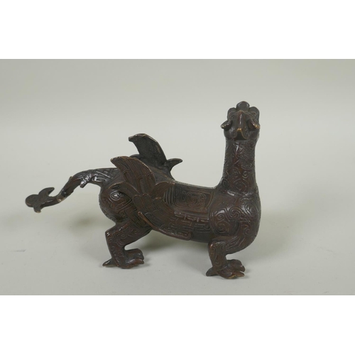 250 - A Chinese filled bronze dragon/kylin, 19cm long