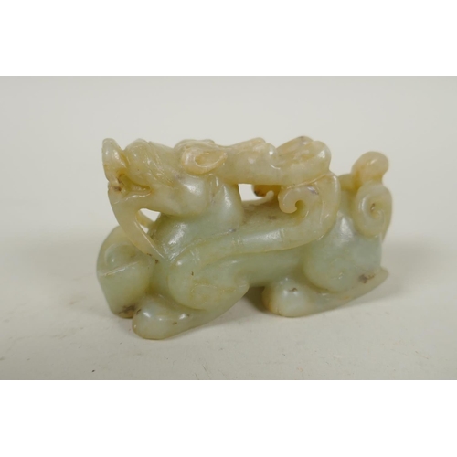 253 - A Chinese carved celadon jade kylin, 8cm