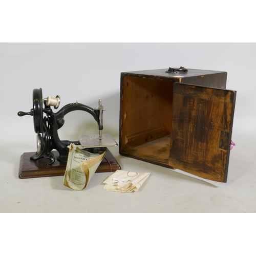 26 - Willcox & Gibbs automatic silent sewing machine, with manual and original pine case, 29cm high