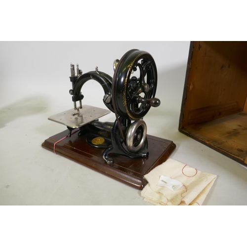 26 - Willcox & Gibbs automatic silent sewing machine, with manual and original pine case, 29cm high