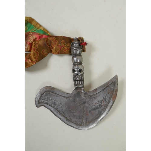 261 - A Tibetan ceremonial white metal Kartika with skull decoration to handle, 17cm