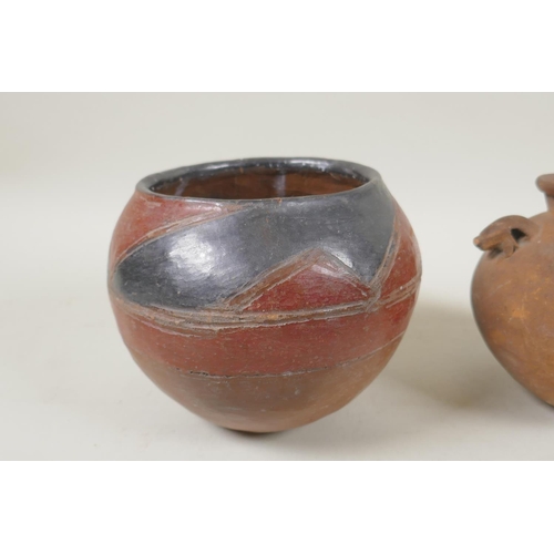 264 - An African clay beer pot, and an antique Continental two handled terracotta pot, 2cm high