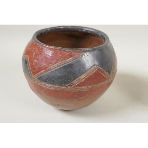 264 - An African clay beer pot, and an antique Continental two handled terracotta pot, 2cm high