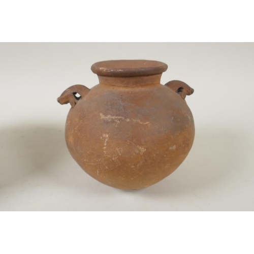 264 - An African clay beer pot, and an antique Continental two handled terracotta pot, 2cm high