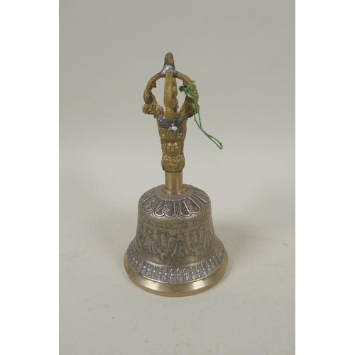 280 - A Tibetan ceremonial metal bell and cymbals, and a bronzed metal vajra, largest 13cm