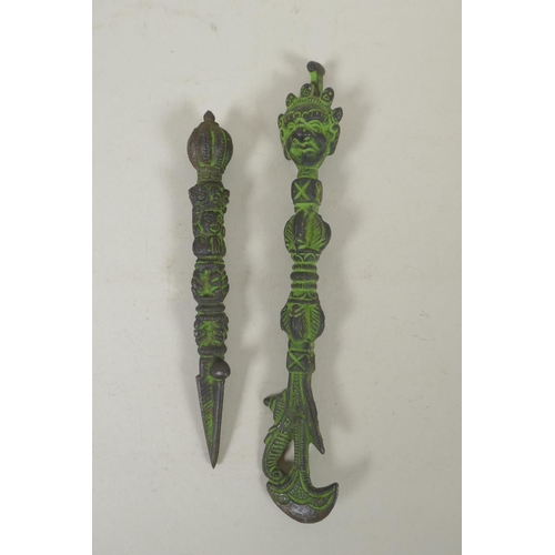 284 - A Tibetan cast iron phurba and matching kartika, 19cm