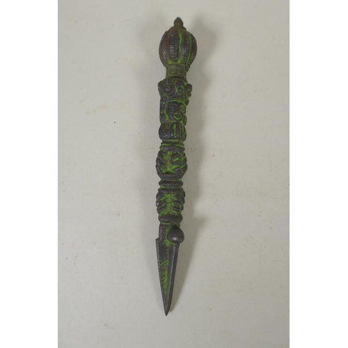 284 - A Tibetan cast iron phurba and matching kartika, 19cm