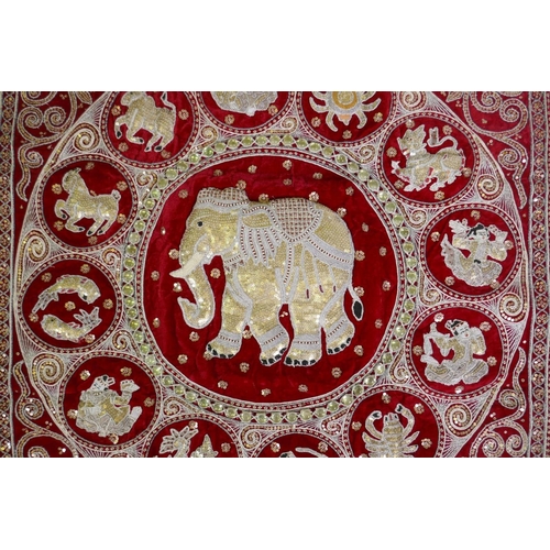 287 - A Thai stump work wall hanging decorated with an elephant surrounded by the zodiac, 95 x 95cm