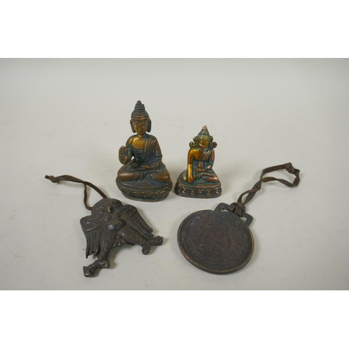 290 - Two Indian miniature bronze Buddhas, a Garuda talisman and a zodiac calendar pendant, largest 7cm