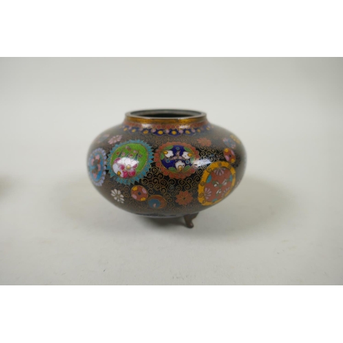 294 - A pair of Japanese Meiji cloisonne pots on tripod supports decorated with floral panels and mons, a ... 