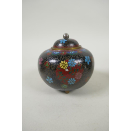 294 - A pair of Japanese Meiji cloisonne pots on tripod supports decorated with floral panels and mons, a ... 