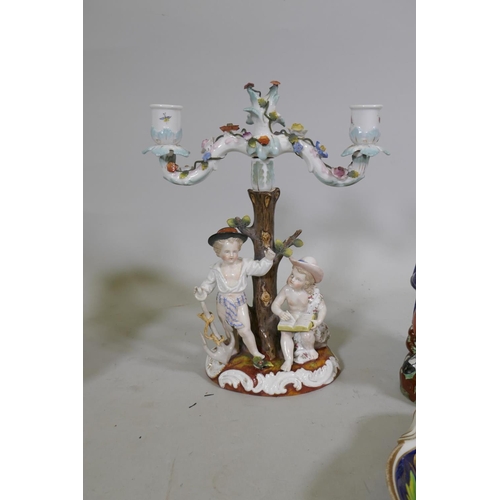 297 - A C19th porcelain two branch candelabra, possibly Sitzendorf, blue sword mark to base, 30cm high, Ro... 