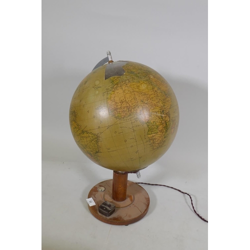 32 - An illuminated terrestrial globe with glass body, AF, 53cm high