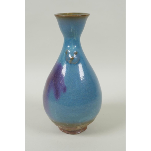 38 - A Chinese Jun ware pottery vase, with twin mask decoration, 20cm high