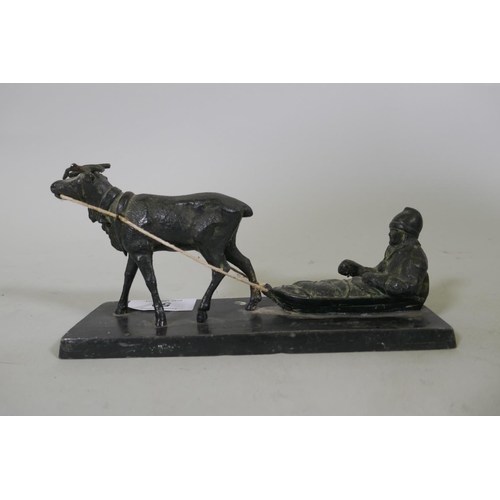 50 - An antique bronzed metal figure of a moose pulling a man in a sled, signed J. Benell-Eneret, 18cm lo... 