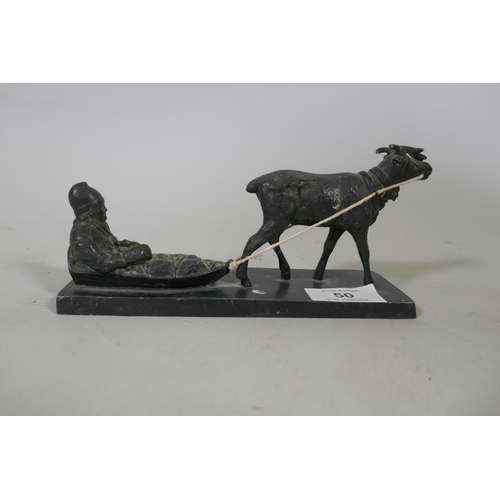 50 - An antique bronzed metal figure of a moose pulling a man in a sled, signed J. Benell-Eneret, 18cm lo... 