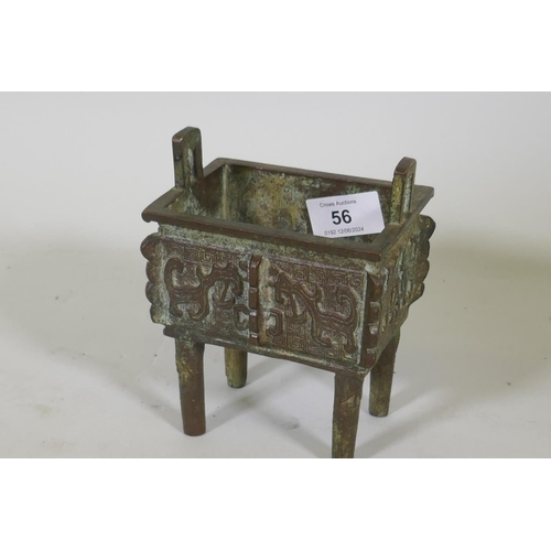 56 - Chinese bronze two handled censer with raised archaic style decoration, 12 x 9 x 15cm