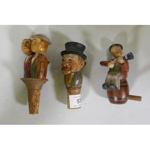 57 - Three vintage carved and painted wood bottle stoppers, all articulated with working parts, 13cm high