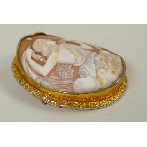 602 - An antique hand carved shell cameo of Asteria in a yellow metal mount, 5.5 x 7cm