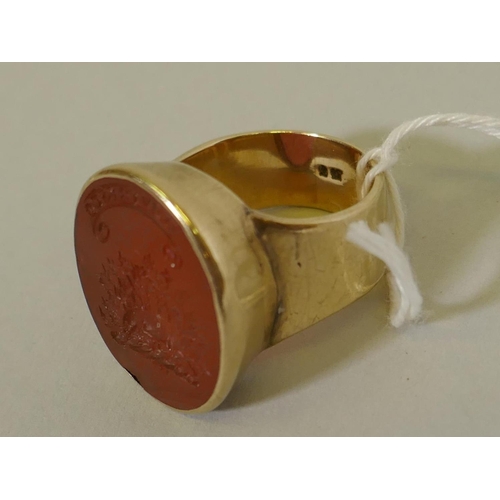 605 - A gold intaglio ring, possibly Scottish, marked 9ct, set with carnelian and carved with the Maxwell ... 