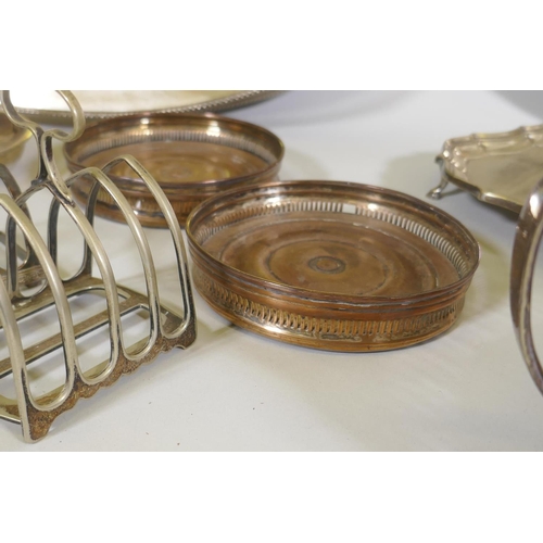 617 - A silver plated gallery tray, castors, toast racks etc