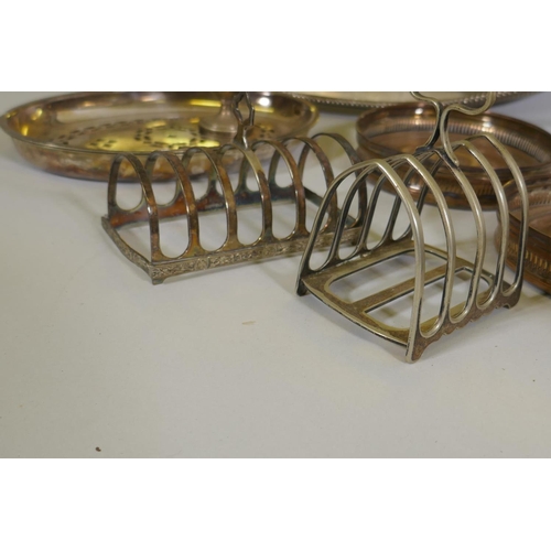 617 - A silver plated gallery tray, castors, toast racks etc