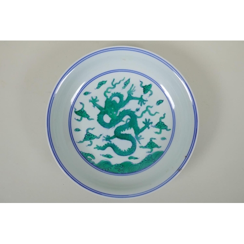 63 - A Chinese blue and white porcelain dish decorated with green enamelled dragons, Chenghua 6 character... 