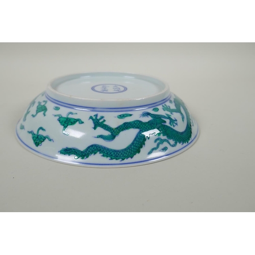 63 - A Chinese blue and white porcelain dish decorated with green enamelled dragons, Chenghua 6 character... 