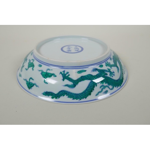 63 - A Chinese blue and white porcelain dish decorated with green enamelled dragons, Chenghua 6 character... 