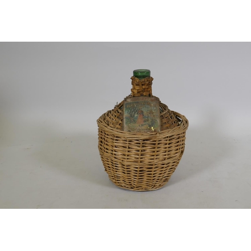 65 - Antique French olive oil jar in woven basket, labelled ANC ne Mson Rinaudo Majano Cie, Nice, 33cm hi... 