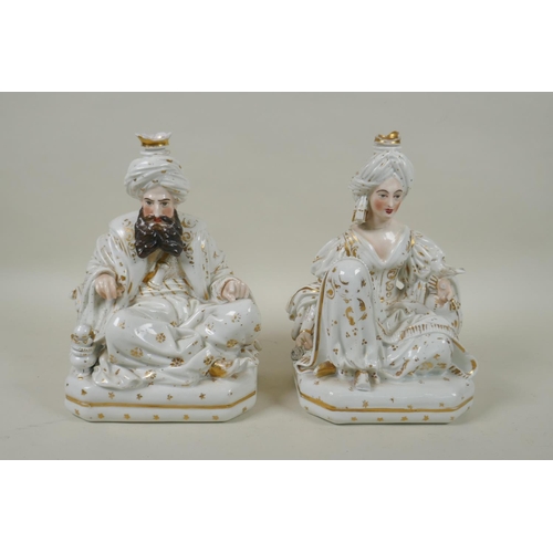 66 - A pair of French porcelain scent bottles modelled as a seated Sultan and Sultana, in the manner of J... 