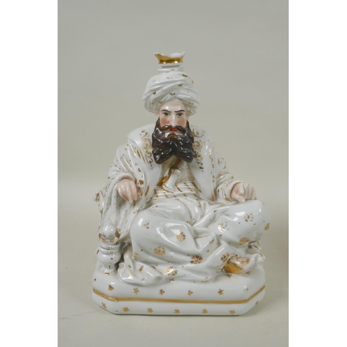 66 - A pair of French porcelain scent bottles modelled as a seated Sultan and Sultana, in the manner of J... 