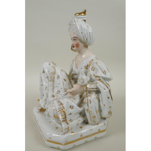 66 - A pair of French porcelain scent bottles modelled as a seated Sultan and Sultana, in the manner of J... 