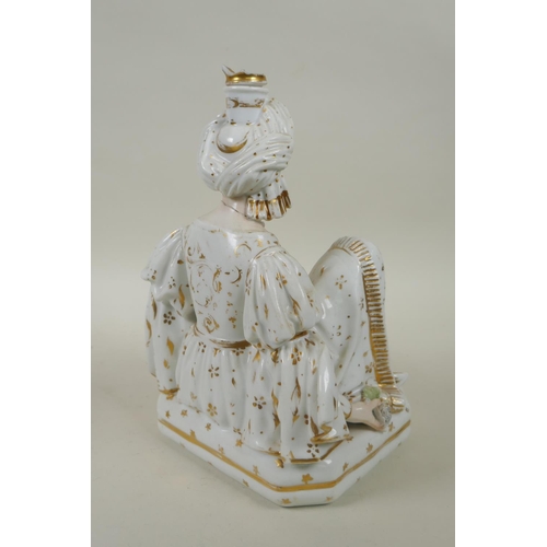 66 - A pair of French porcelain scent bottles modelled as a seated Sultan and Sultana, in the manner of J... 