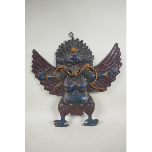 68 - A Tibetan cold painted pressed metal Garuda wall mount, 45 x 47cm