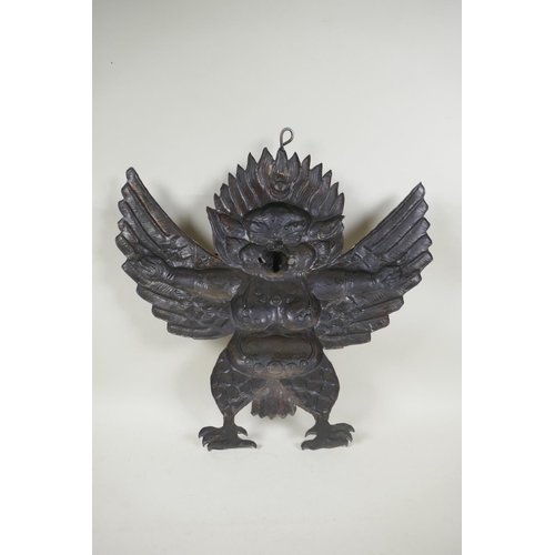 68 - A Tibetan cold painted pressed metal Garuda wall mount, 45 x 47cm