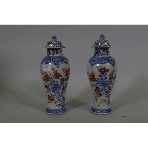 7 - A Pair of C19th Chinese Imari pattern vases with covers, AF chips, racks and repairs, 28cm high